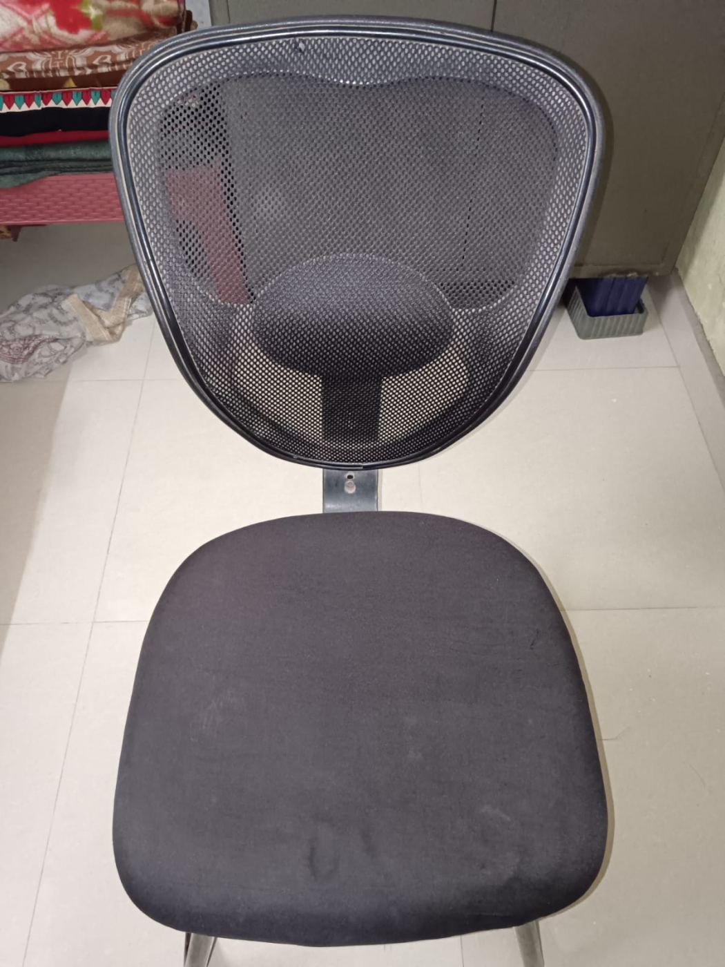 Nylon Mesh office chair without hand rest support.