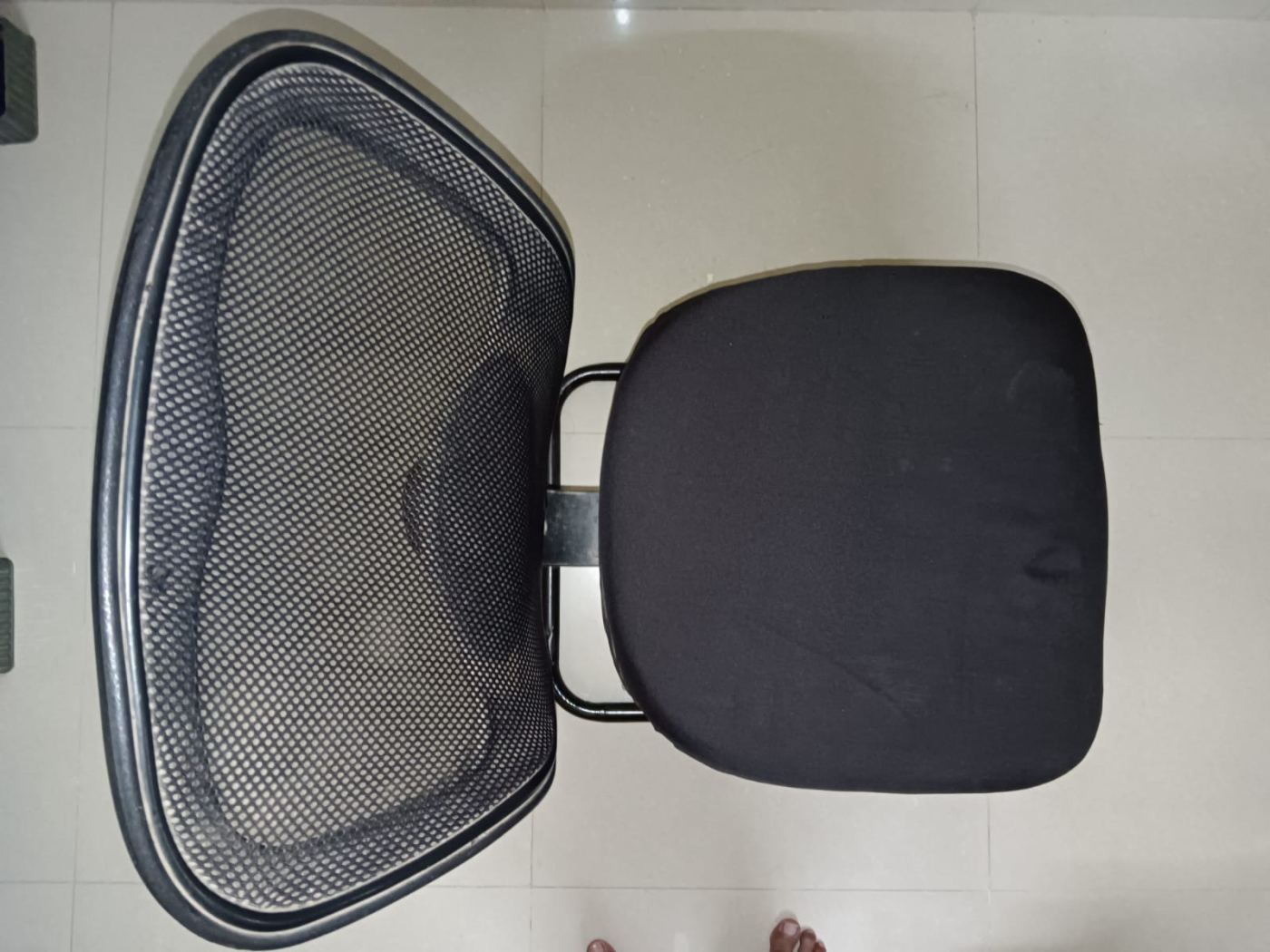 Nylon Mesh office chair without hand rest support.